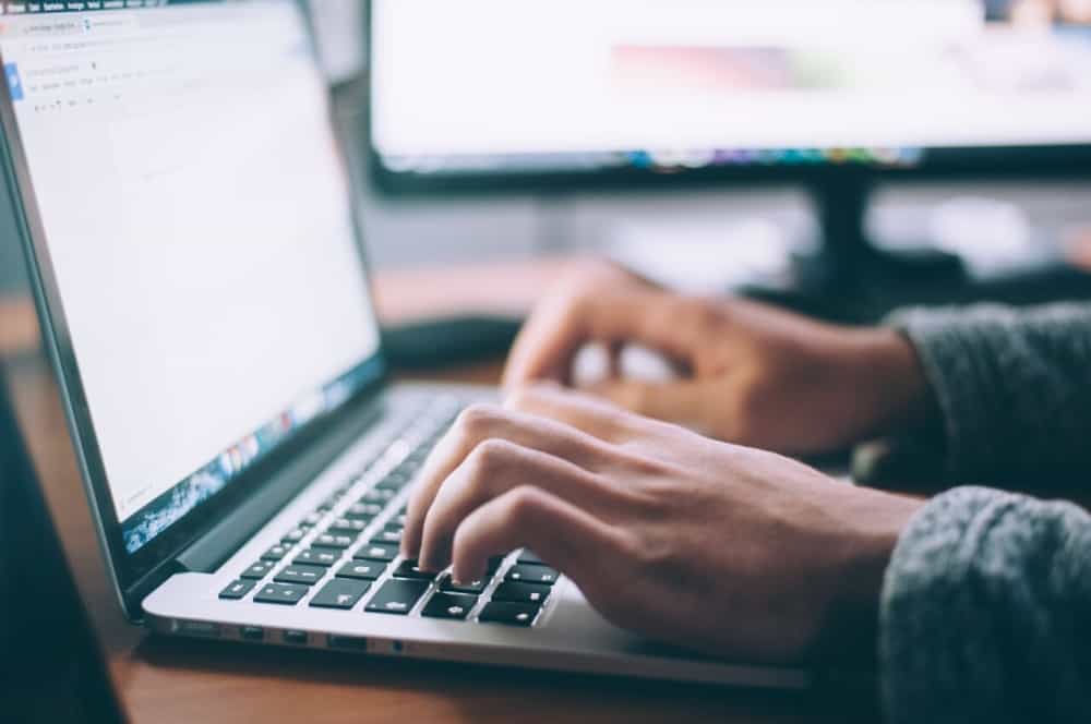 employee laptop typing