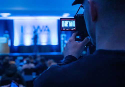 Event video production crew filming a corporate event in Singapore