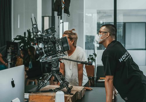 Video production company team planning a corporate shoot in Singapore